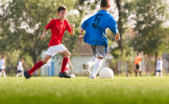 a group of boys playing football