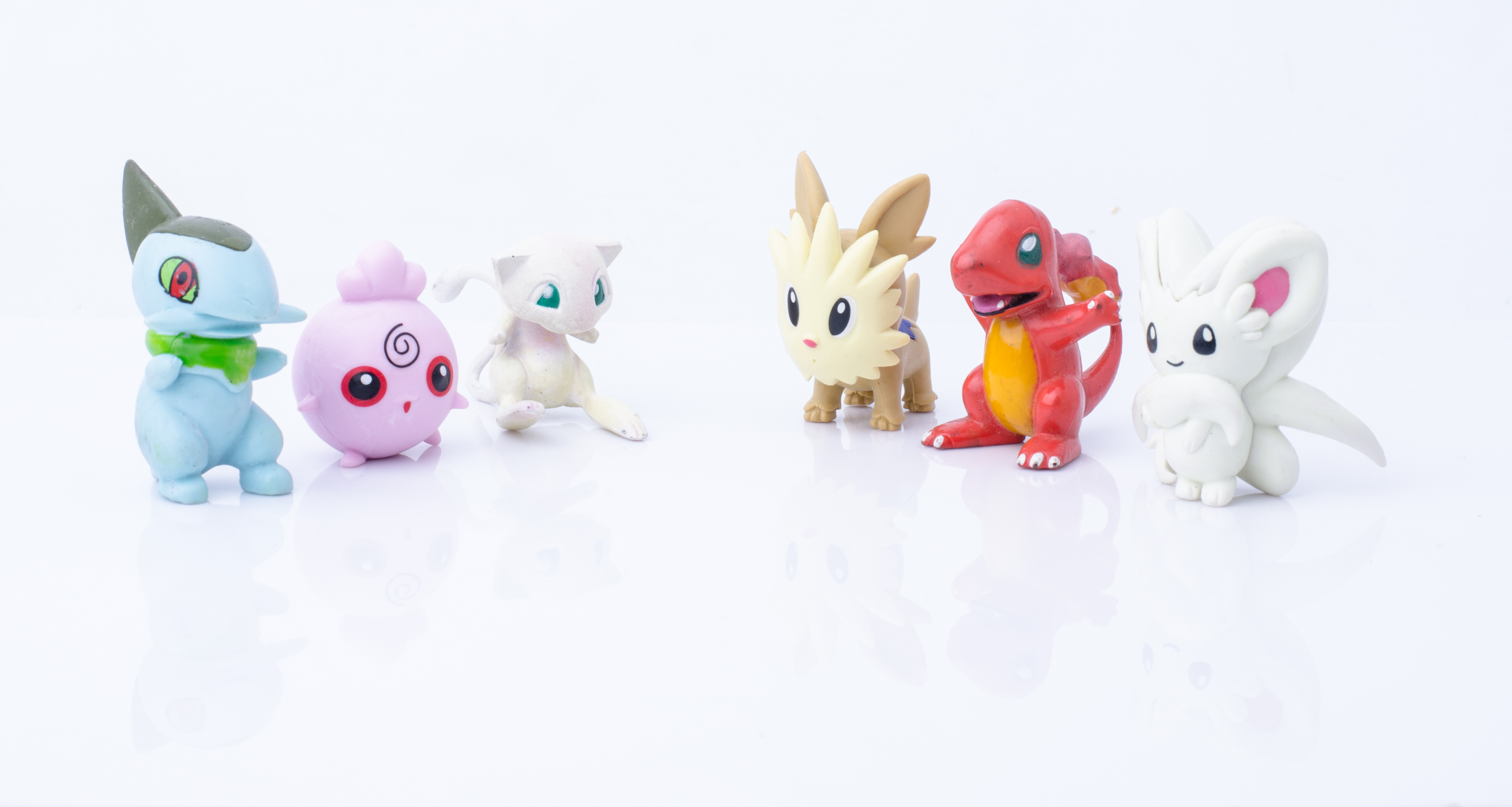 a bunch of plastic pokemone figurines