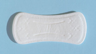 A menstrual pad on a blue background