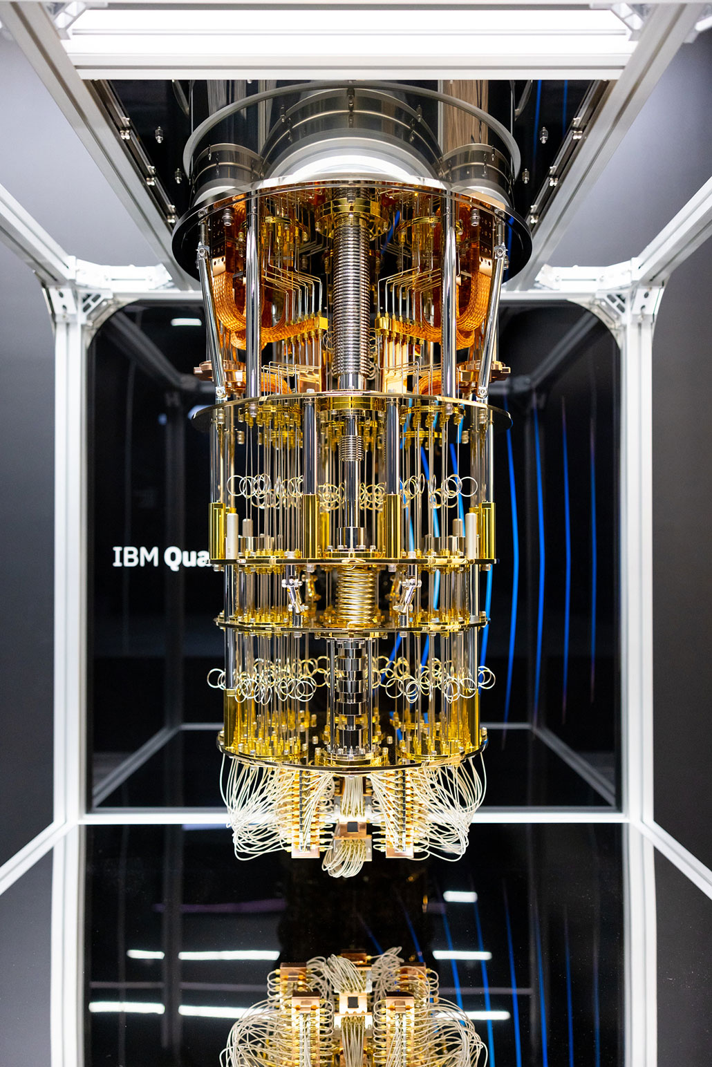 a photo of a Quantum computer machine, resembling a giant golden chandelier hanging from the ceiling