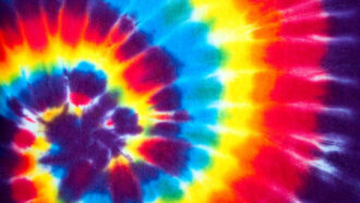 a spiral of tie-dye colors alternates between purple, blue, yellow and red