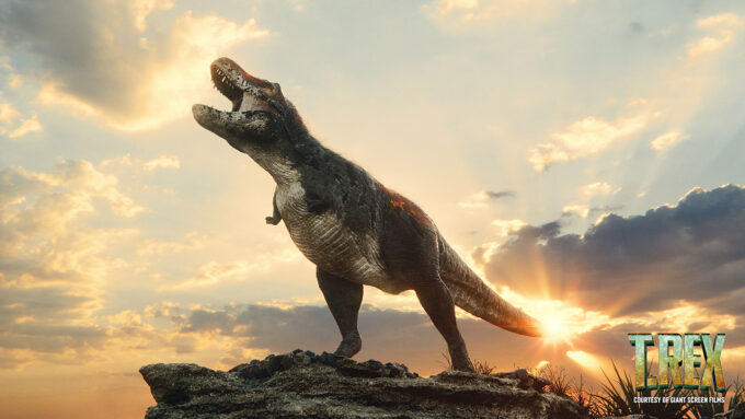 a simulated image of a T-rex standing on a outcropping and roaring at sunrise