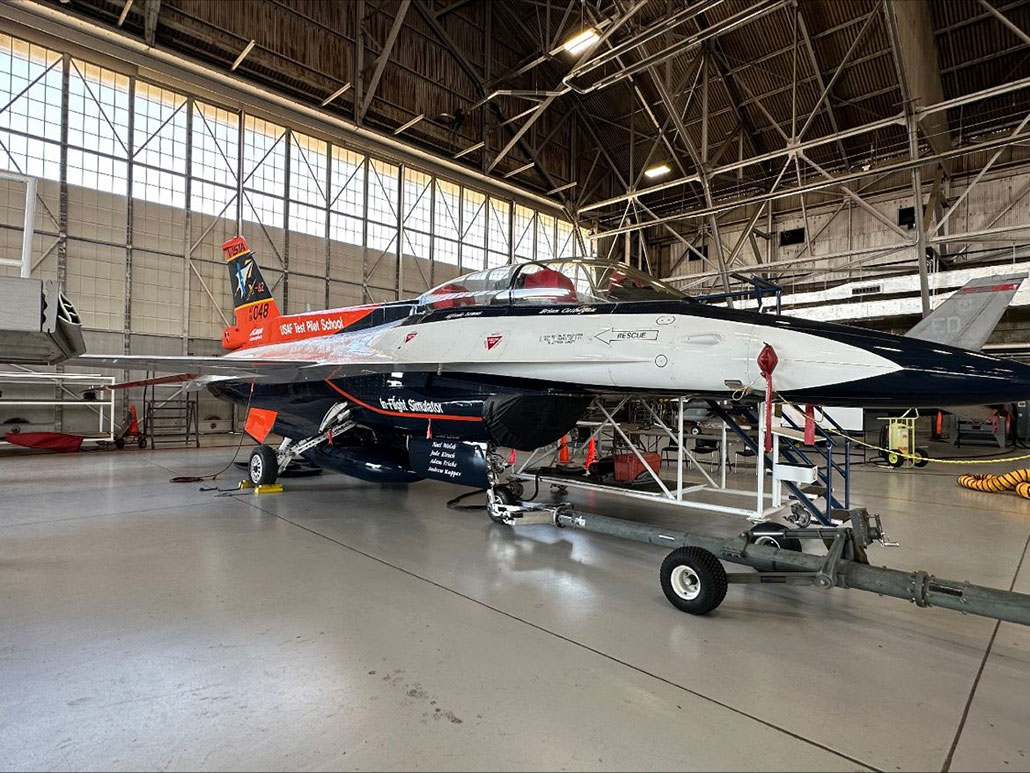 a picture of a sleek test jet in a hangar