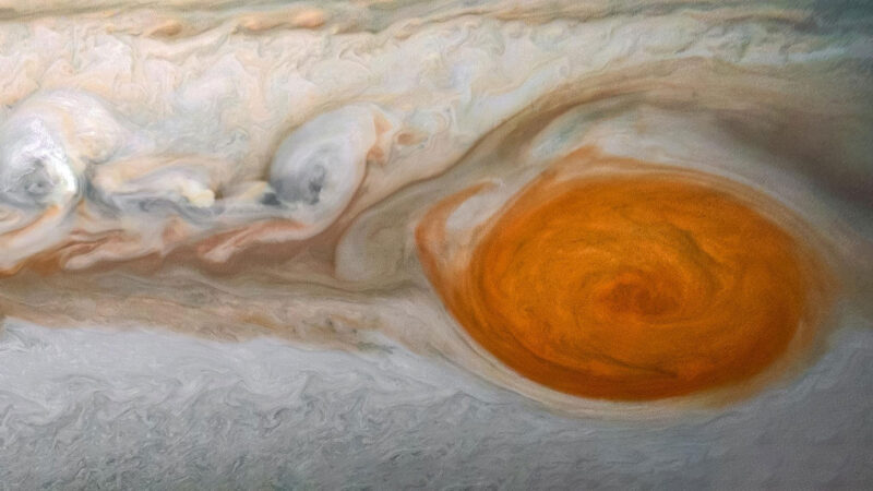 a close-up color photo of Jupiter's Great Red Spot, a giant swirling red storm