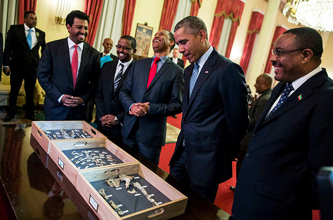 then-President Barack Obama viewed the fossil fragments with several other men