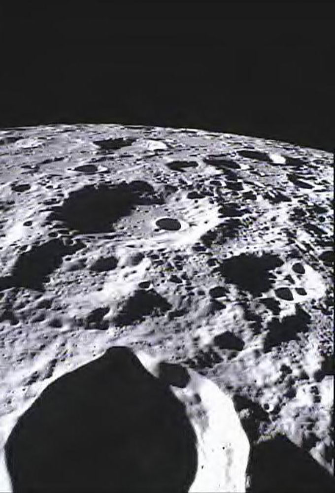 a photo of the surface of the moon, showing Crater Poinsot, a crater not visible from Earth