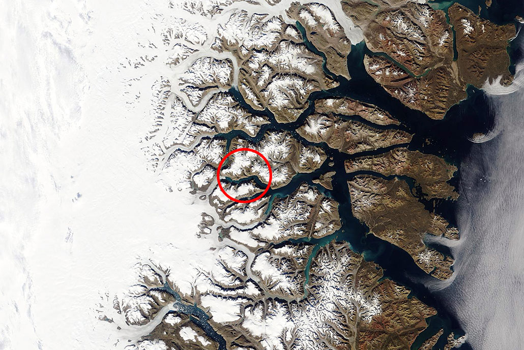 a satellite image of the landslide location, a red circle indicates location